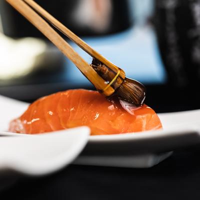 Nigiri Salmon, sauce brushing, close up.