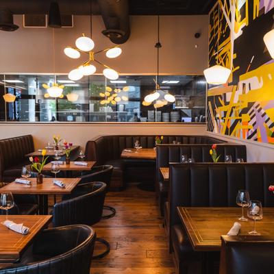 Restaurant dining area, fully set tables and booths