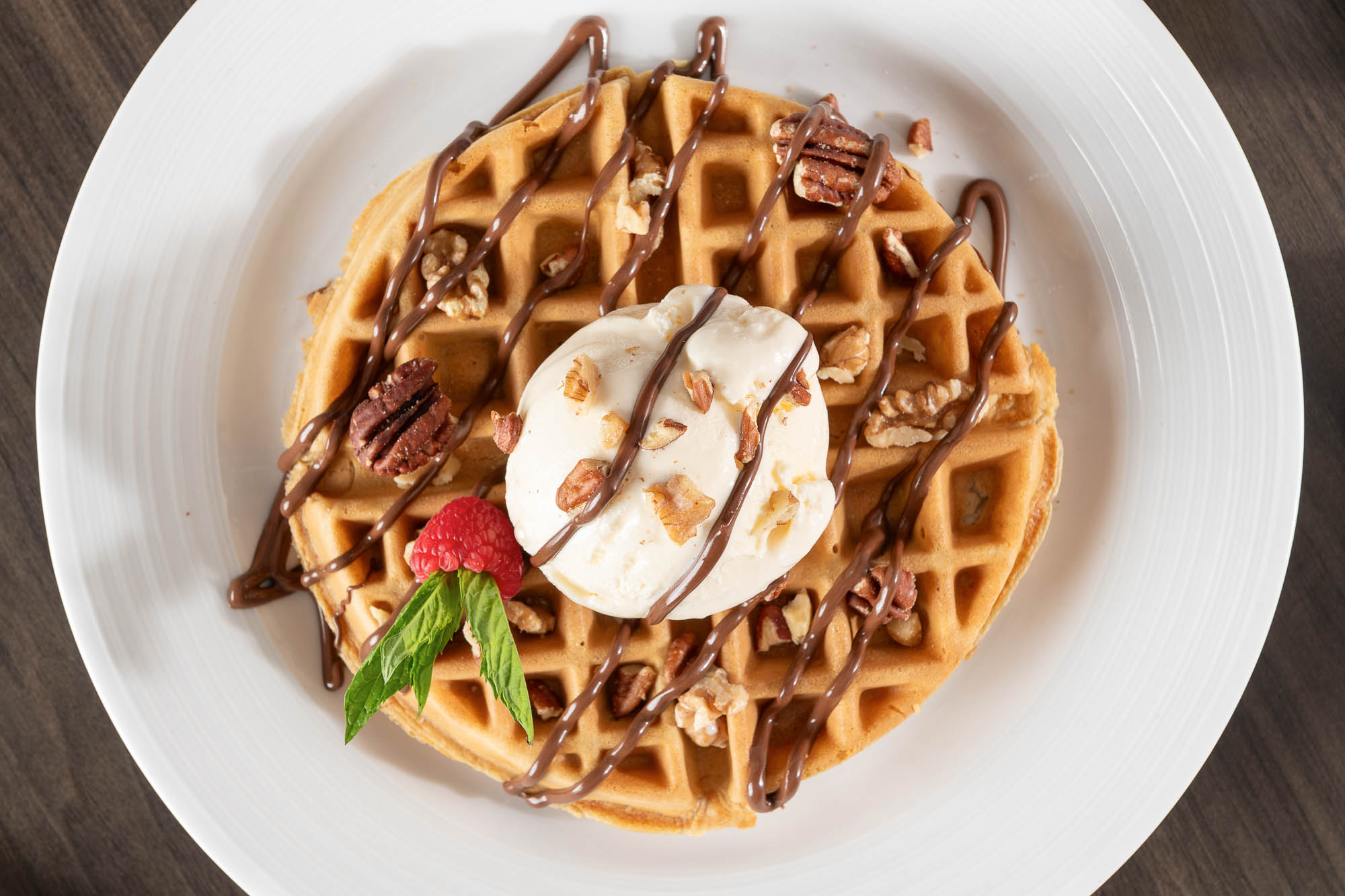 Nutella Waffle topped with a scoop of vanilla ice cream