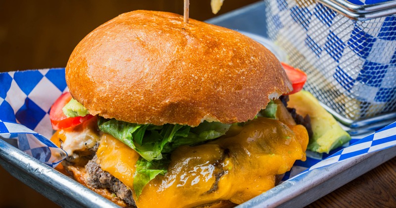 Brioche burger served with seasoned fries