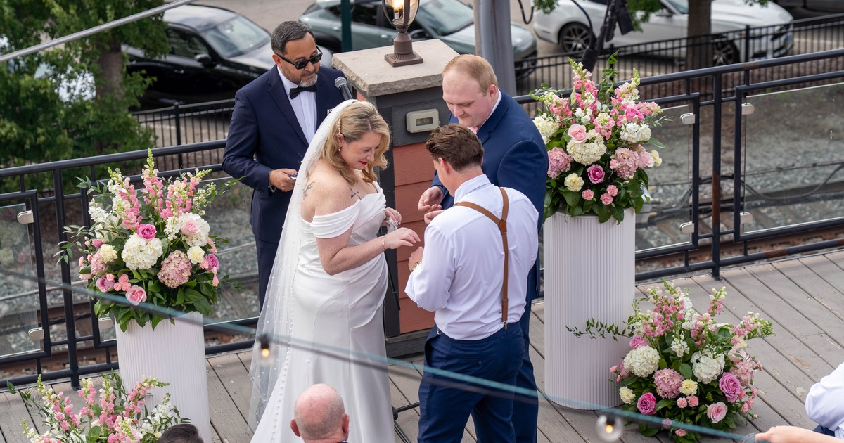 Couple during their wedding ceremony on a rooftop