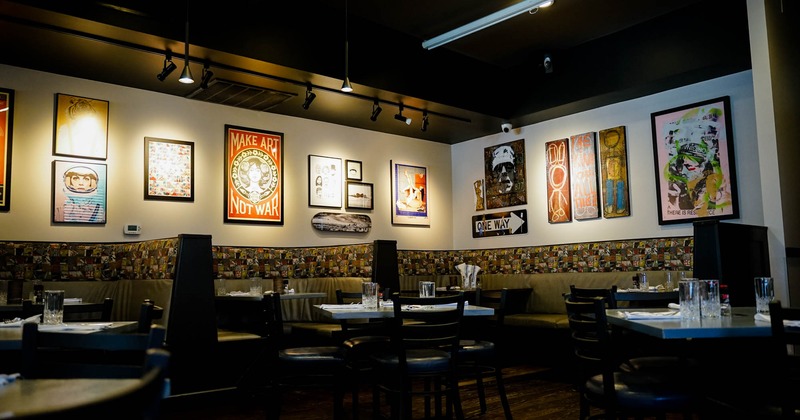 Interior, dining area with posters and paintings on the walls