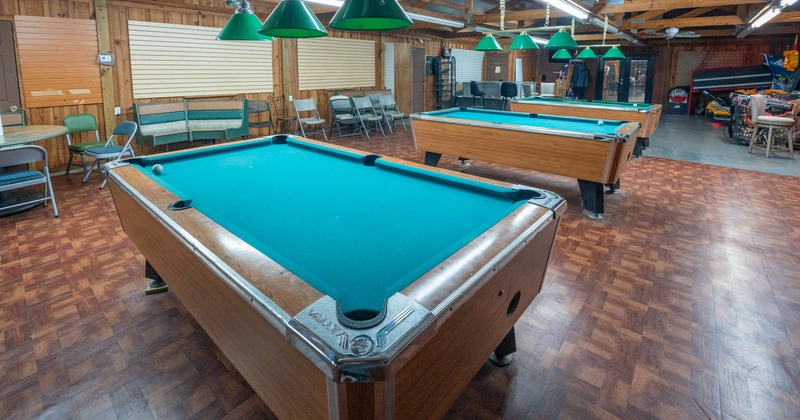 Interior, pool tables with seating around them