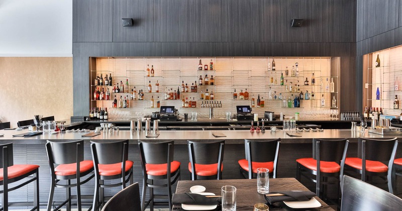 Interior, dining area with a bar in the back