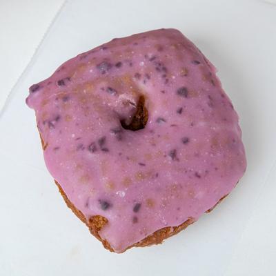 A square-shaped donut with blueberry icing.