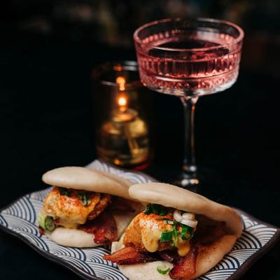 Eggs Benedict buns, and a cocktail.