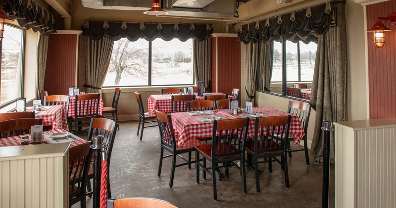 Cozy interior dining area with set tables