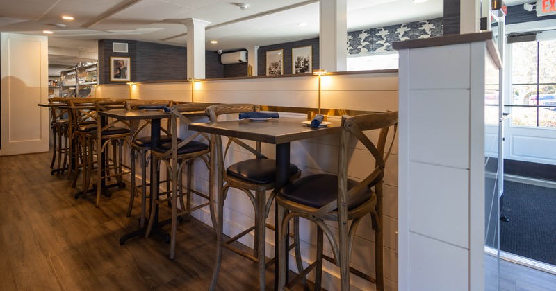 Interior of a restaurant with wooden tables and chairs