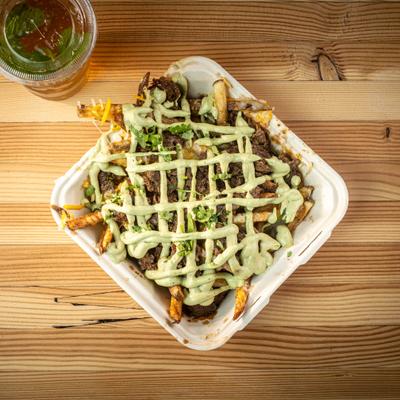 Loaded fries topped with grilled carne asada meat, cheese and a sauce drizzle.
