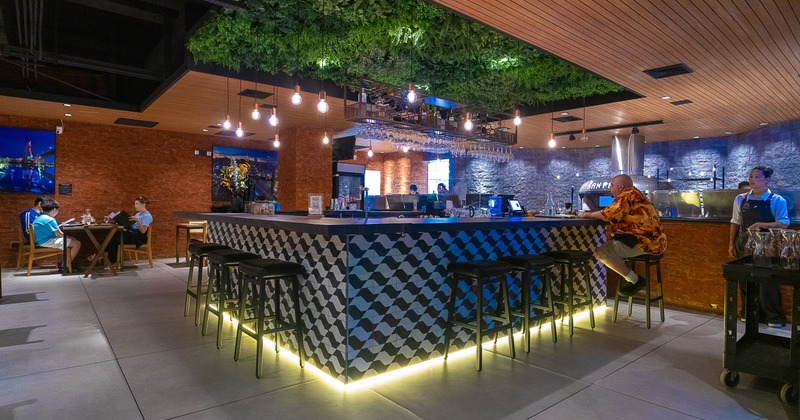 Interior, bar, stools, ceiling made of plant leaves above