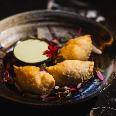 Empanadas, with dipping sauce.
