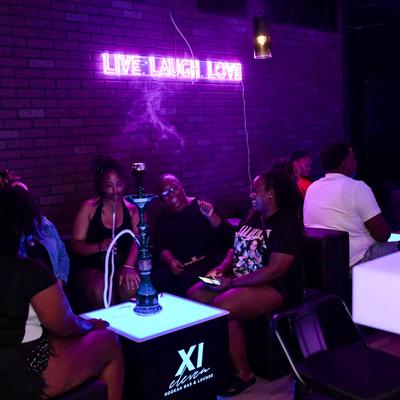 Guests smoking a hookah.