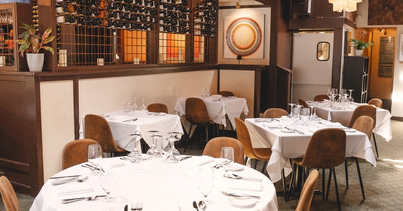 Restaurant interior, dining area with set tables