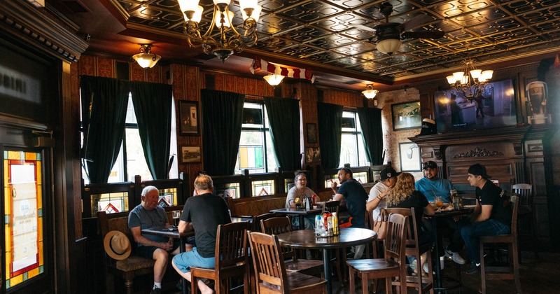 Interior of a pub with guests dining at tables