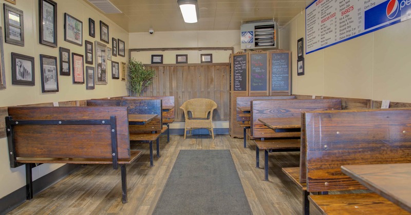 Interior, tables and wooden benches lined up