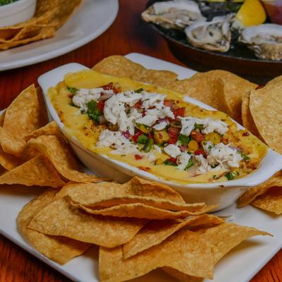 Seafood Queso dip served with tortilla chips.