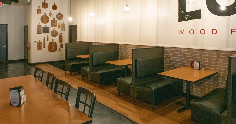 Interior, dining area, booths with wooden top tables for four