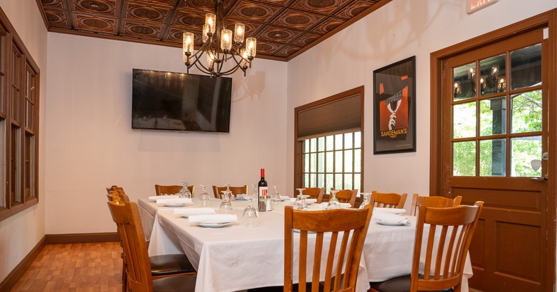 Elegant private dining room with a large dining table, perfect for a small dinner gathering