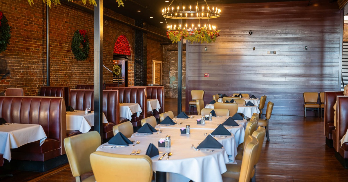 Interior, table set for guests in dining area