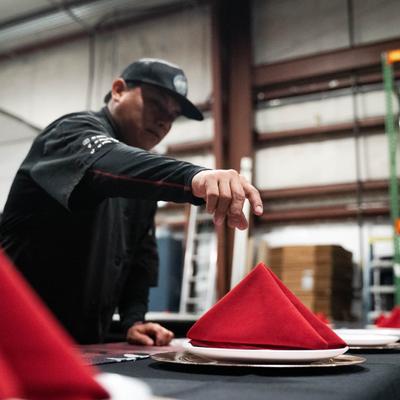 Employee setting the table.