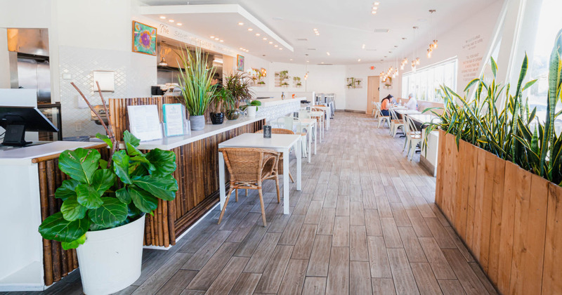 Interior, guest tables and chairs, and order counter