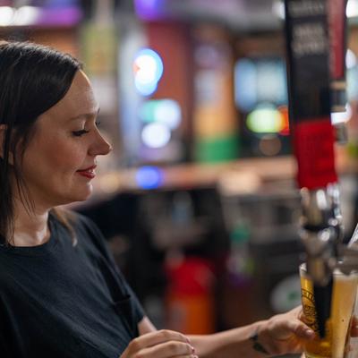 Bartender pouring beer.