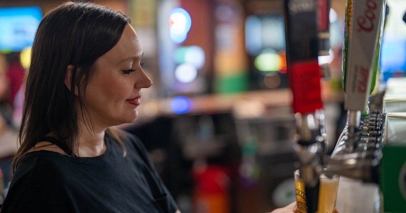 Bartender pouring beer