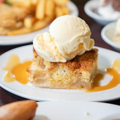 Apple cobbler pie with vanilla ice cream.