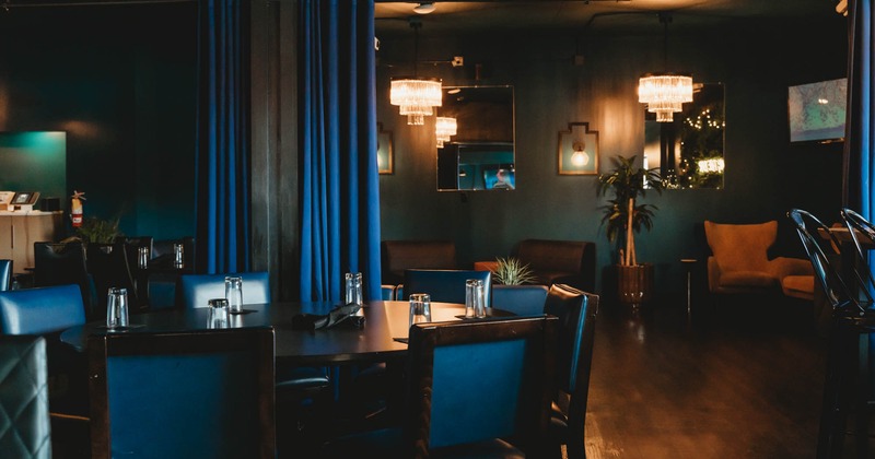 Interior, dining area, round wooden top table with chairs, hardwood flooring