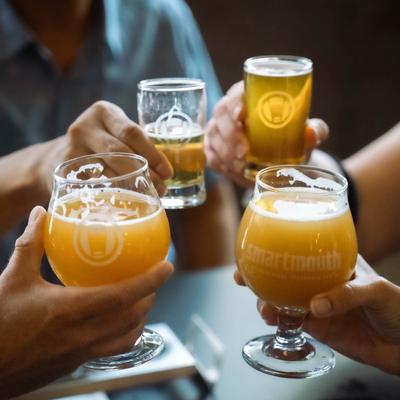 Customers toasting with beers.