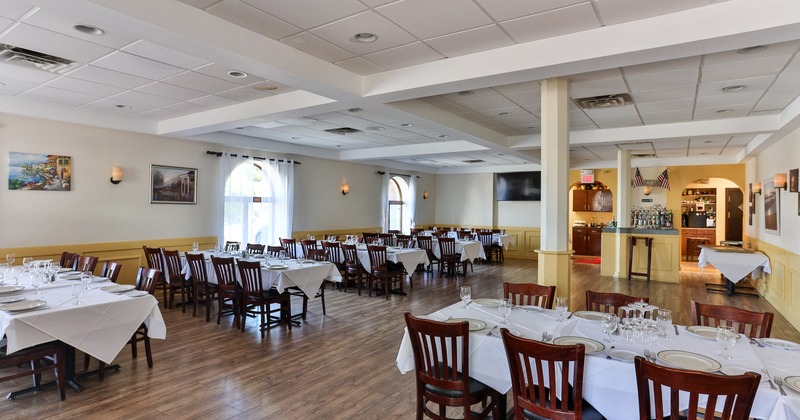Nicely done private dining room with set tables ready for guests