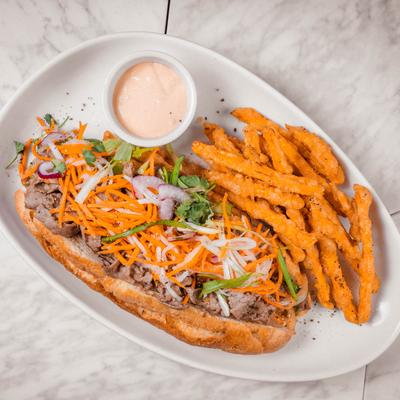 Banh Mi with side of sweet potato fries.