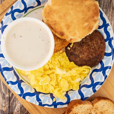 Breakfast Platter, with biscuits, gravy, sausage patty, and scrambled eggs.