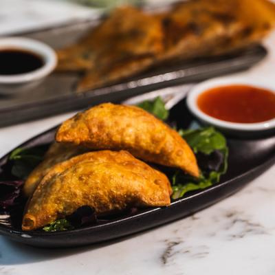 Crab Rangoon with dipping sauce.