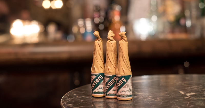 Interior, three pack Underberg bitters on a table