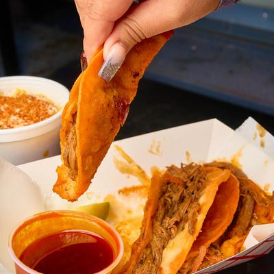 Birria Tacos and dip.