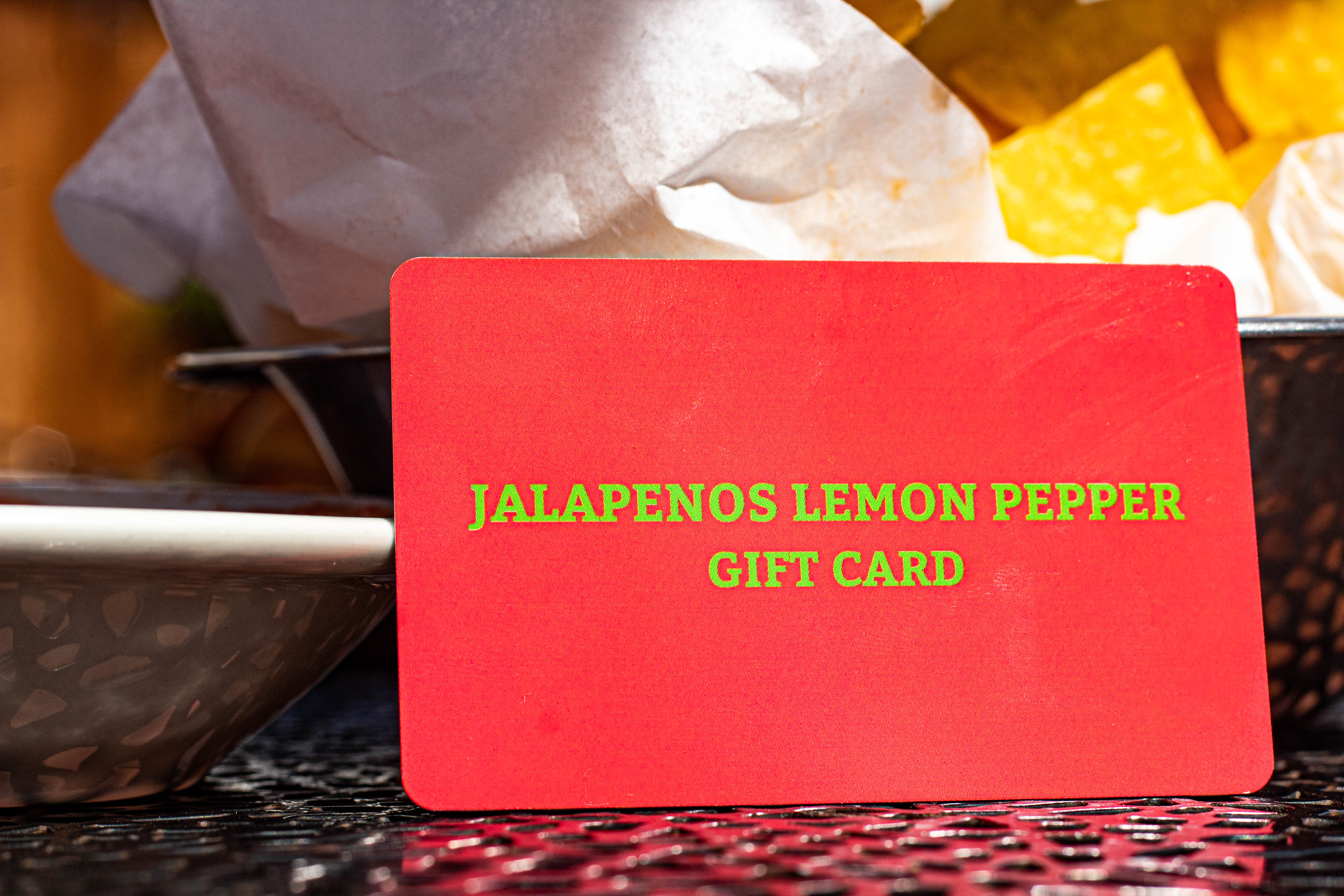 Jalapenos Lemon Pepper Gift Card on a counter, close up