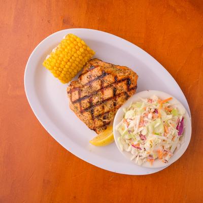 Grilled meat, mixed salad and grilled corn