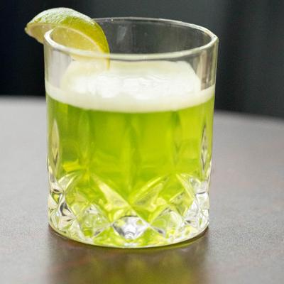 I Love You Bay cocktail garnished with a lime wedge.