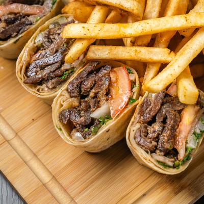 Arabic beef shawarma wraps served with fries.