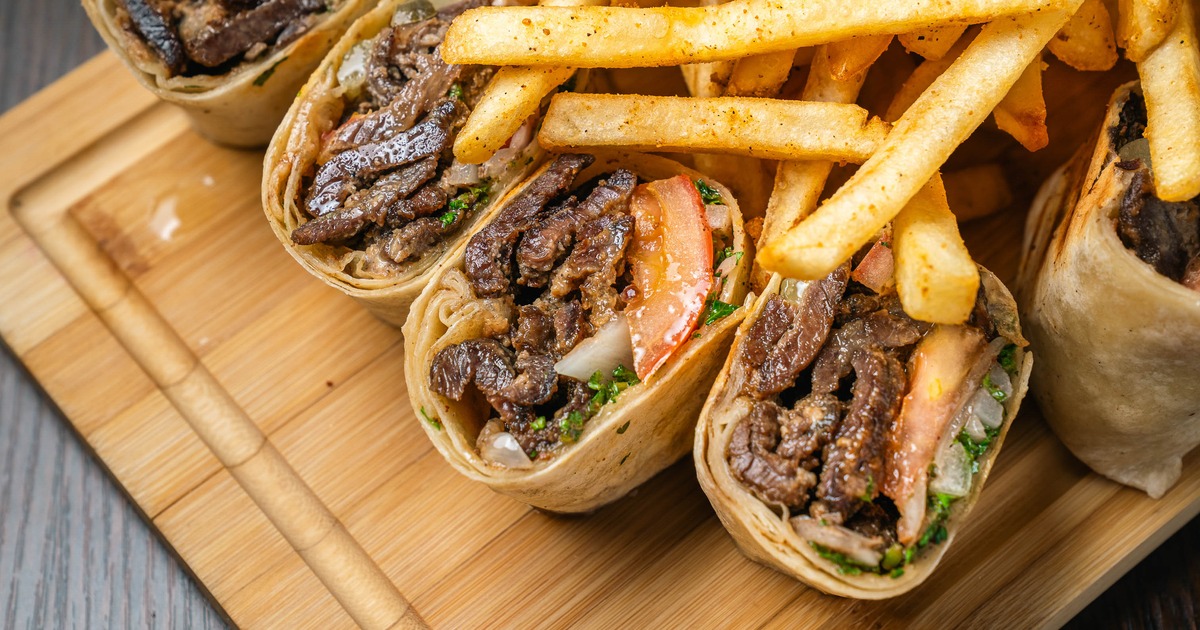 Arabic beef shawarma wraps served alongside seasoned fries