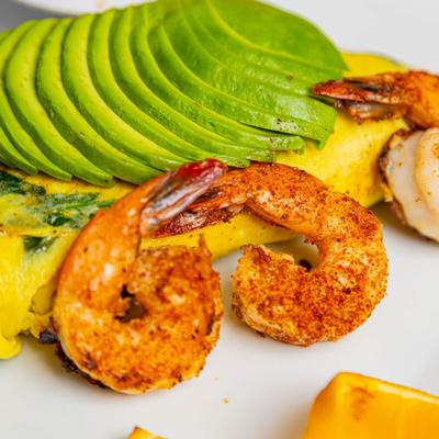 Avocado shrimp omelet, close up.