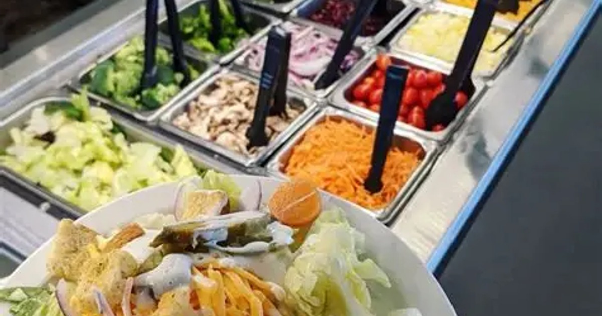 Well-stocked restaurant salad bar featuring a wide variety of fresh ingredients