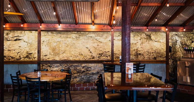 Interior, dining area, wooden table, and hanging lights