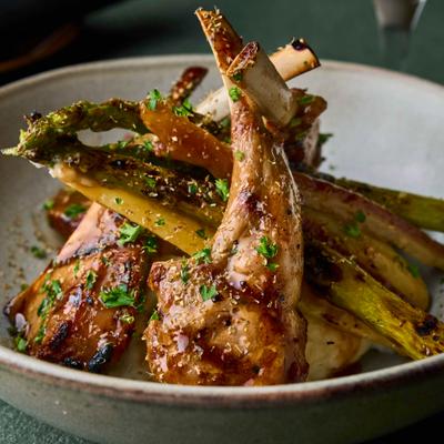 Lamb chops served with grilled asparagus.