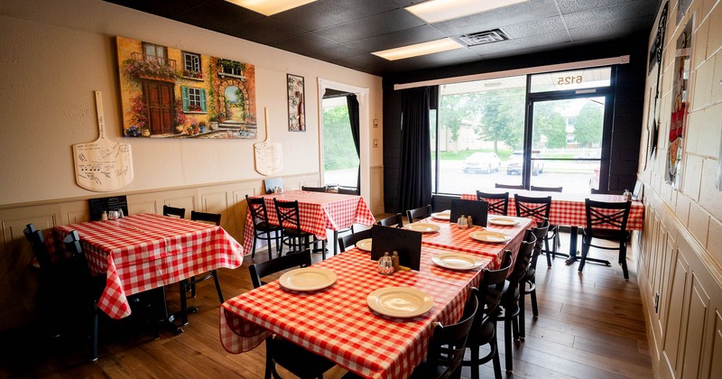 Interior, tables and chairs with outside view