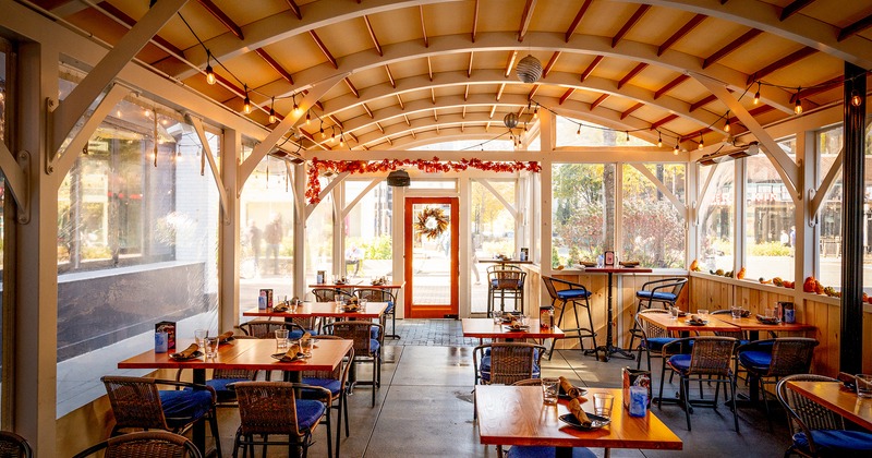 Enclosed patio with set dining tables