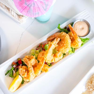 Fried shrimp with a side of smoky chipotle dipping sauce.