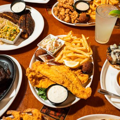 Southern seafood dishes including catfish, fried shrimp, and sides.