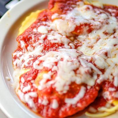 Chicken parmigiana with pasta.